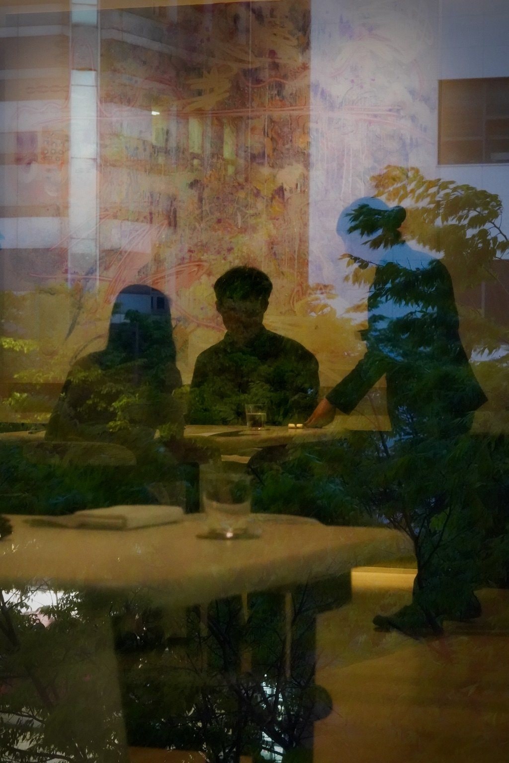 Silhouettes and reflections in a Seoul restaurant