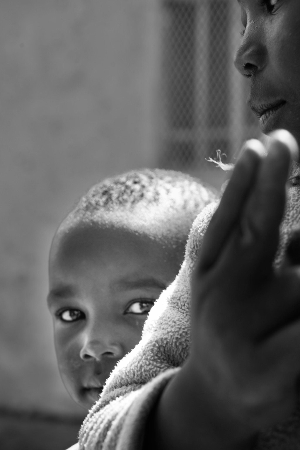 A child looking toward the camera in Soweto